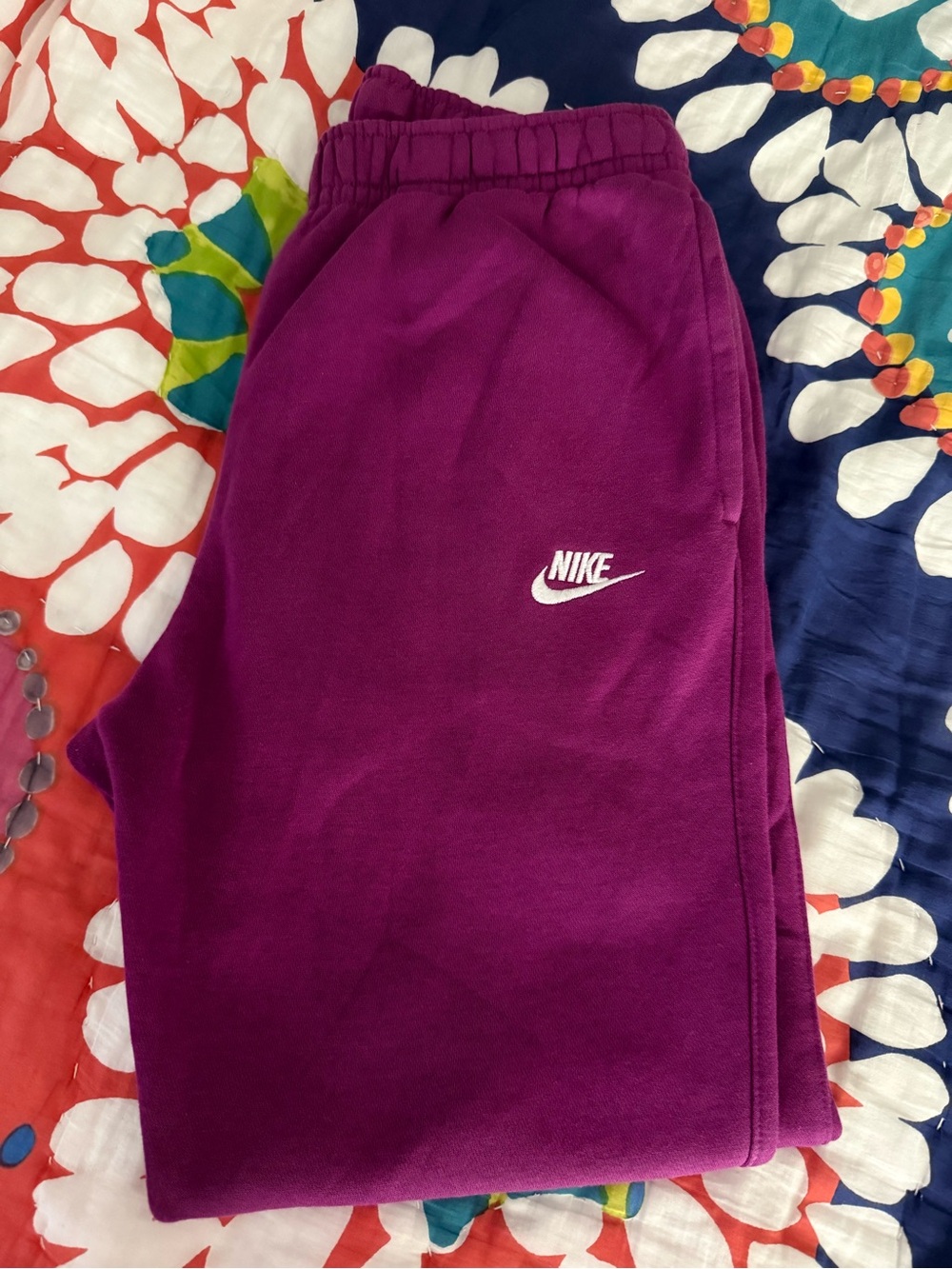 Nike women’s  Fleece Joggers in purple/magenta with White Logo